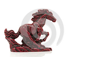 Old-fashioned figurine red horse