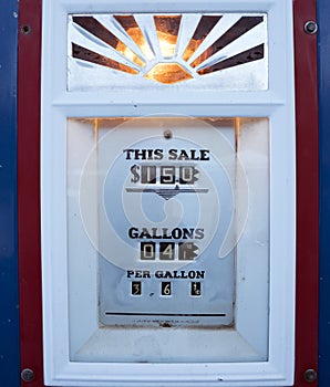 Old fashioned gas pump in use