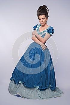 Old fashioned girl in blue dress