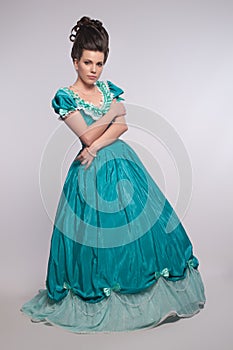 Old fashioned girl in cyan dress