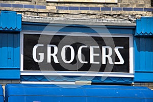 Old Fashioned Grocers Sign above a Shop