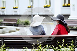 Old fashioned ladies chatting on the bench