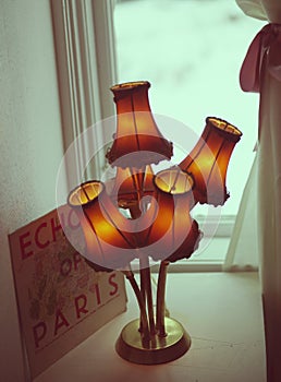 Old fashioned lamp and Echo of Paris` advert