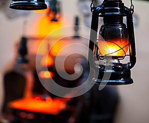 Old fashioned lantern in darkness. Light concept.