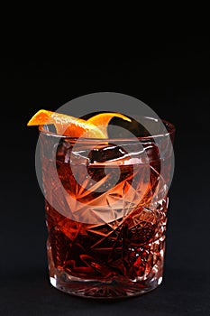 Old fashioned Negroni cocktail on the black background.