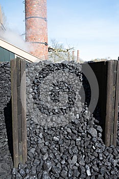 Old-fashioned, non-environmental heating fuel, black rock coal for use in stoking area, air pollution