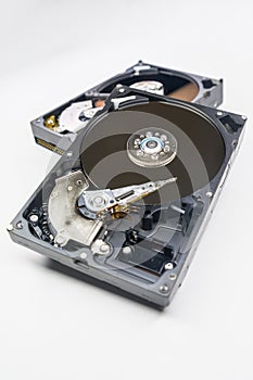 Old fashioned, open, mechanical harddisc drive, isolated on a white background