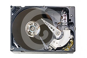 Old fashioned, open, mechanical harddisc drive, isolated on a white background