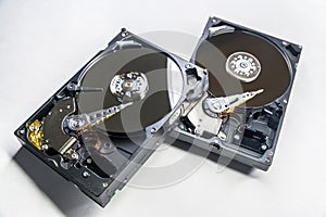 Old fashioned, open, mechanical harddisc drives, isolated on a white background