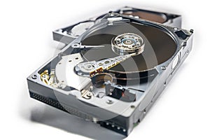 Old fashioned, open, mechanical harddisc drives, isolated on a white background