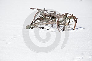 Old fashioned plough in the snow