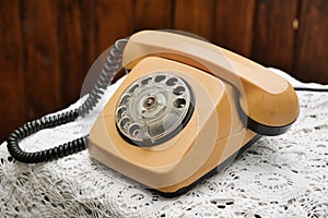 Old-fashioned retro style telephone with rotary dial. Vintage phone.
