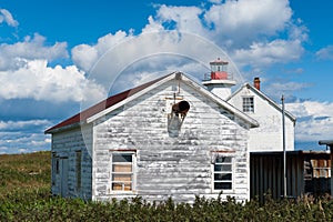 Old-fashioned rustic house and lighthouse