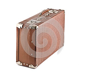 Old-fashioned scratched suitcase isolated