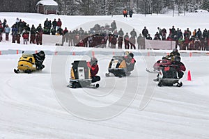 Old fashioned snowmobiles photo