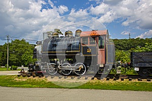 Old Fashioned Steam Engine on Tracks