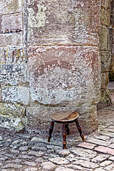 Old-fashioned stool - Raglan Castle, Monmouthshire, South Wales photo