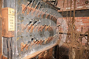 An Old Fashioned Switch Board Full of Rusty Levers With Black Handles in an Abandoned Theatre