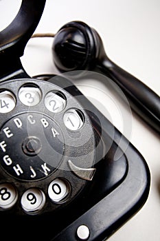 Old-fashioned telephone on the white backing