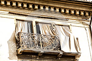 Old fashioned traditional wood window with beautiful balcony in Venice, Italy