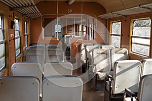 Old fashioned train orange color wagon.