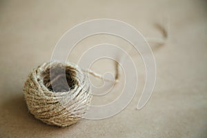 Old fashioned twine on a brown vintage background. Empty space for text