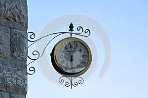 Old fashioned wall clock with `Paddington station` text inside