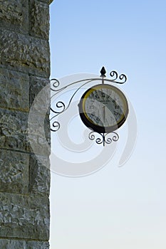 Old fashioned wall clock with `Paddington station` text inside