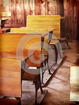 Old fashioned wooden desks in a schoolhouse