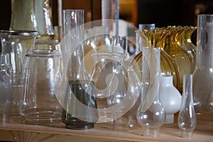 Old fasioned glass vessels on the shelf