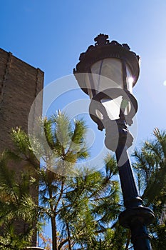 Old fasioned street light agains blue sky in Barcelona