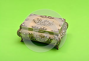 Old fassioned treasure box isolated on green background
