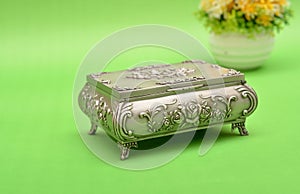 Old fassioned treasure box isolated on green background