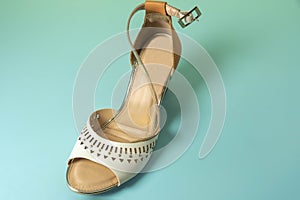 Old female classic shoes on colorful background