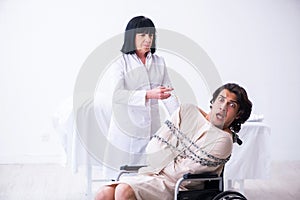 Old female psychiatrist visiting young male patient