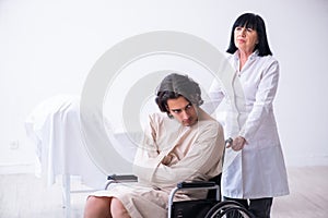 Old female psychiatrist visiting young male patient