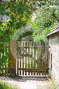 Old fence and gate to a cottage garden