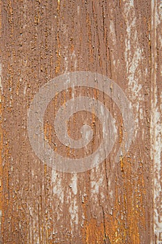 Old fence made of wooden boards. Background, texture of painted wood. Brown color