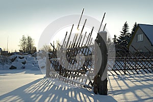 Old fence in snowy countryside