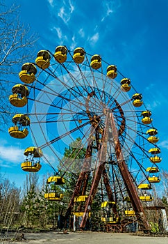 Old ferris wheel in the ghost town of Pripyat. Consequences of the accident at the Chernobil nuclear power plant