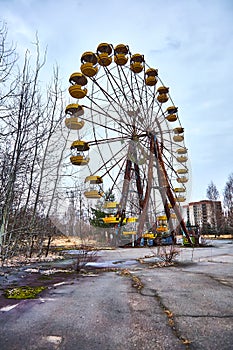 Old ferris wheel in the ghost town of Pripyat. Consequences of the accident at the Chernobil nuclear power plant