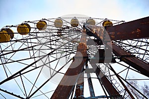 Old ferris wheel in the ghost town of Pripyat. Consequences of the accident at the Chernobil nuclear power plant