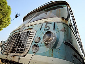 Old bus in a scrapyard photo