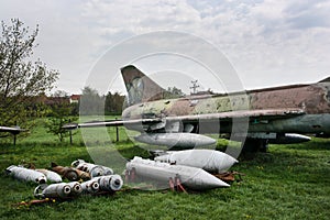 Old fighter plane with a variety of bombs