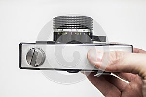 Old film camera in hands