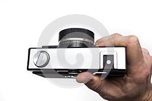 Old film camera in hands