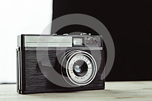 Old film camera. White background close-up.