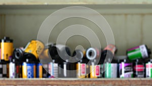 Old film camera on wood shelves for photographic film.blur effect for background