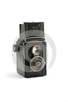 Old film photo camera on white background