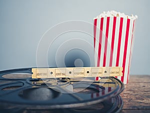 Old film reel, popcorn and tickets